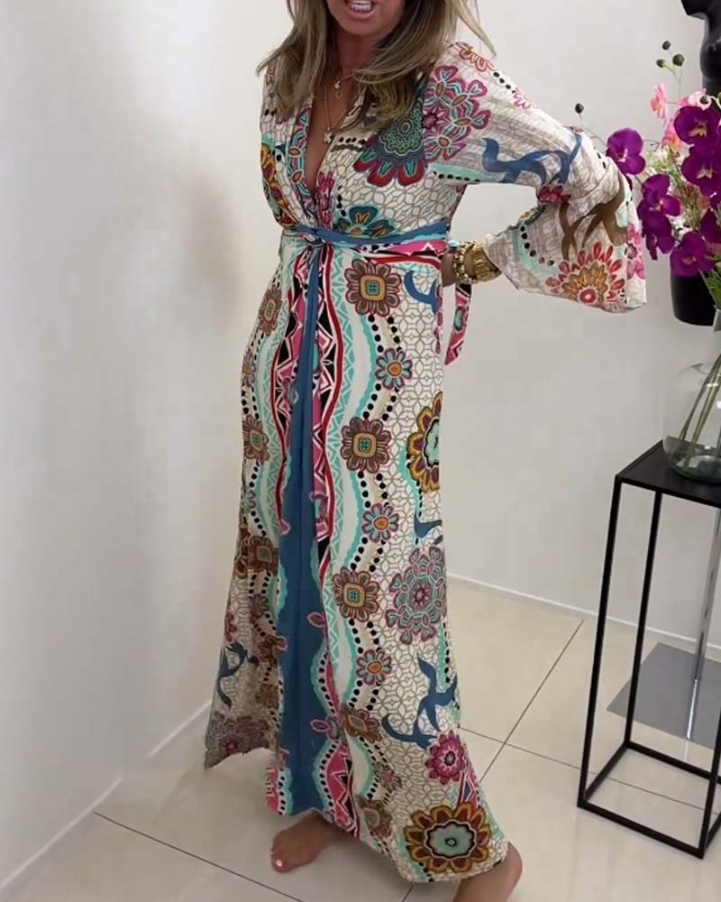 Elegant dress with colorful print and bell sleeves