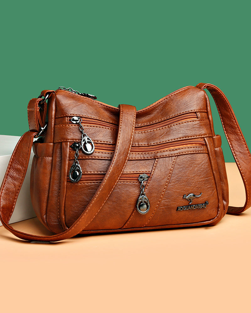 Multi-pocket soft leather crossbody bag