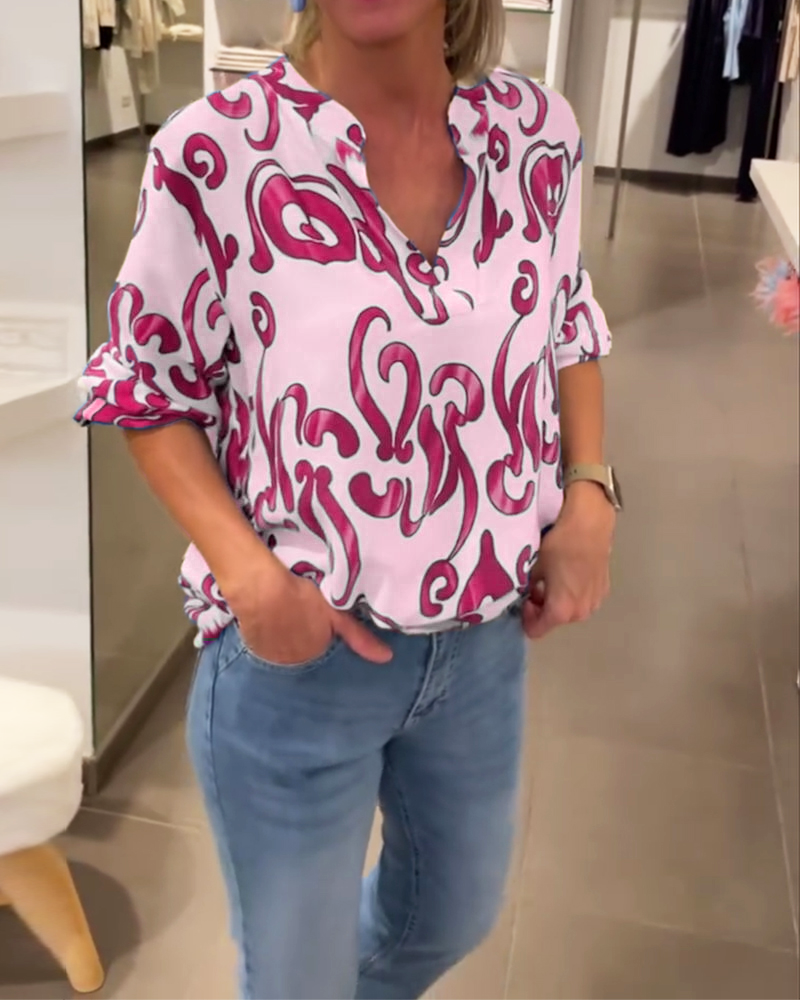 Elegant long-sleeved top with printed V-neck