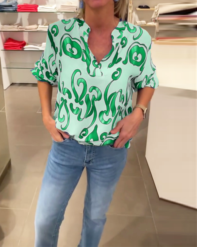 Elegant long-sleeved top with printed V-neck