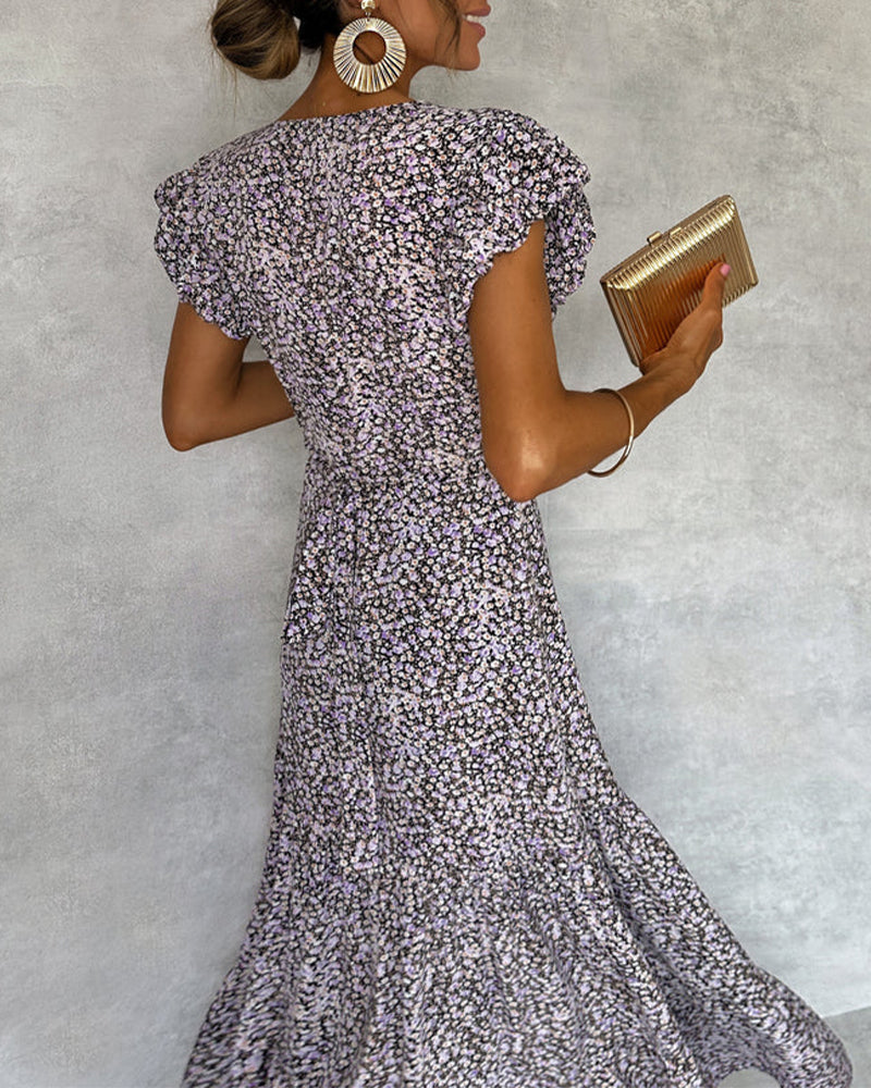 Elegant dress with ruffled sleeves and slit