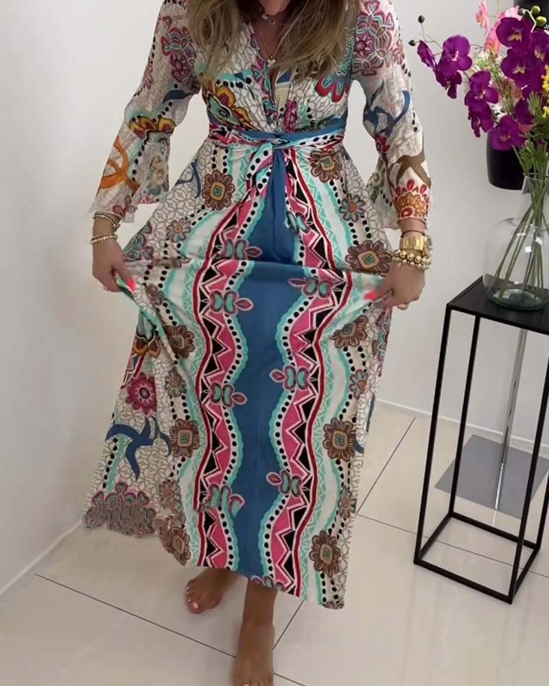 Elegant dress with colorful print and bell sleeves