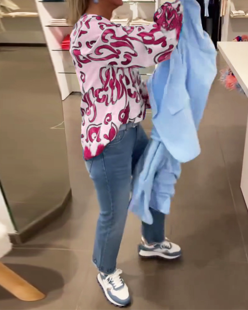 Elegant long-sleeved top with printed V-neck