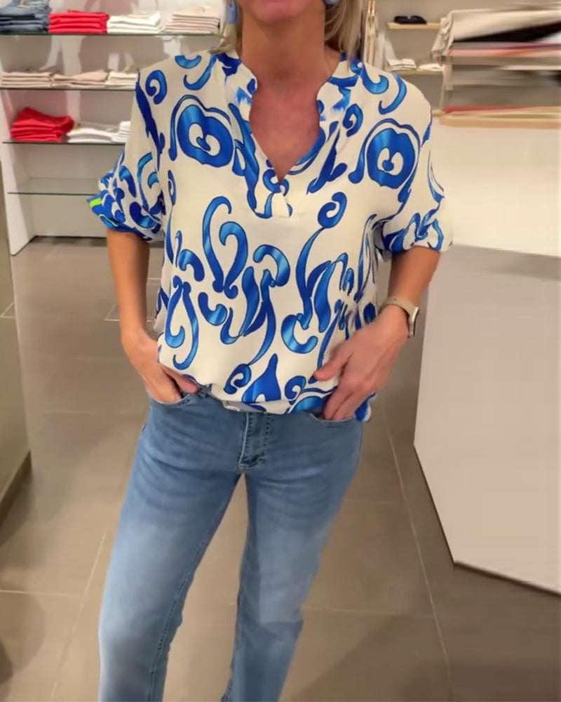 Elegant long-sleeved top with printed V-neck