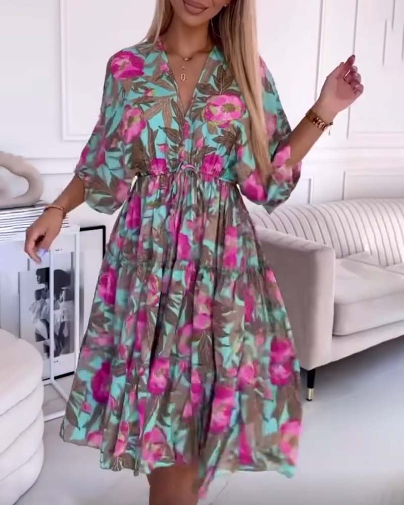 Elegant dress with drawstring ties and floral print