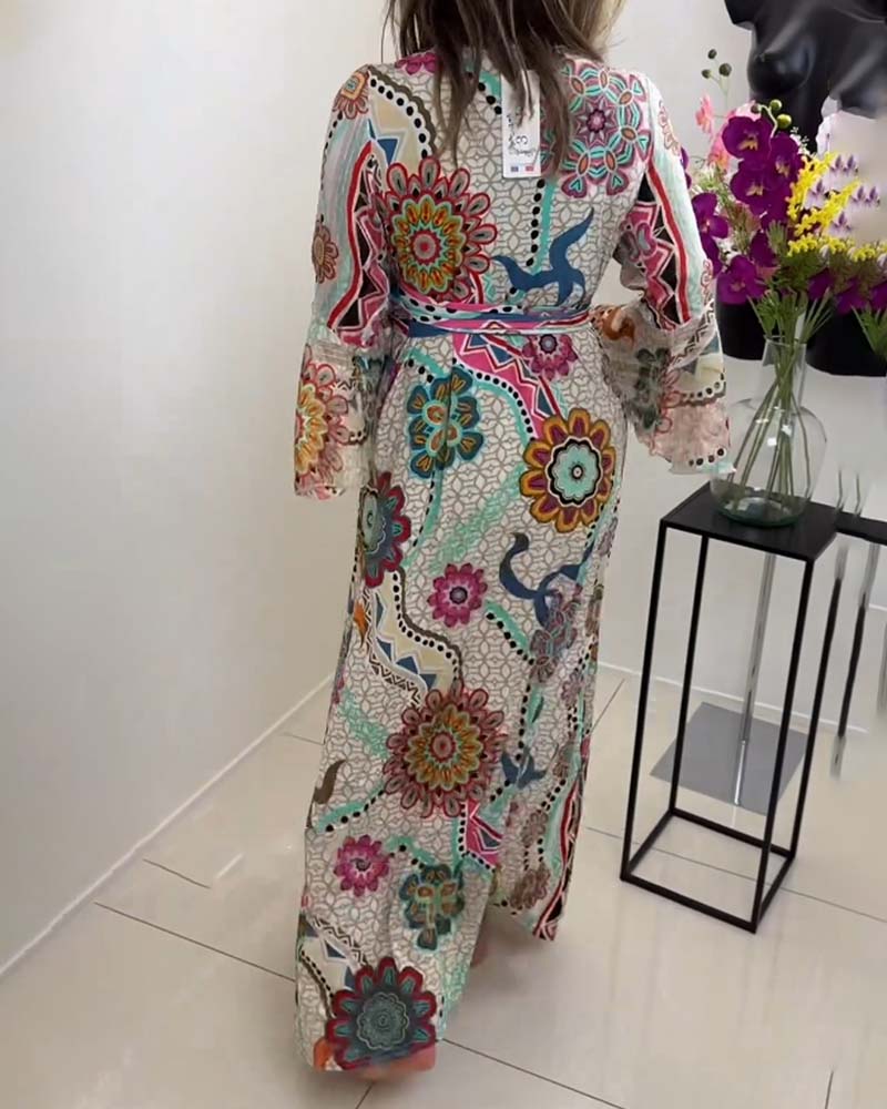 Elegant dress with colorful print and bell sleeves